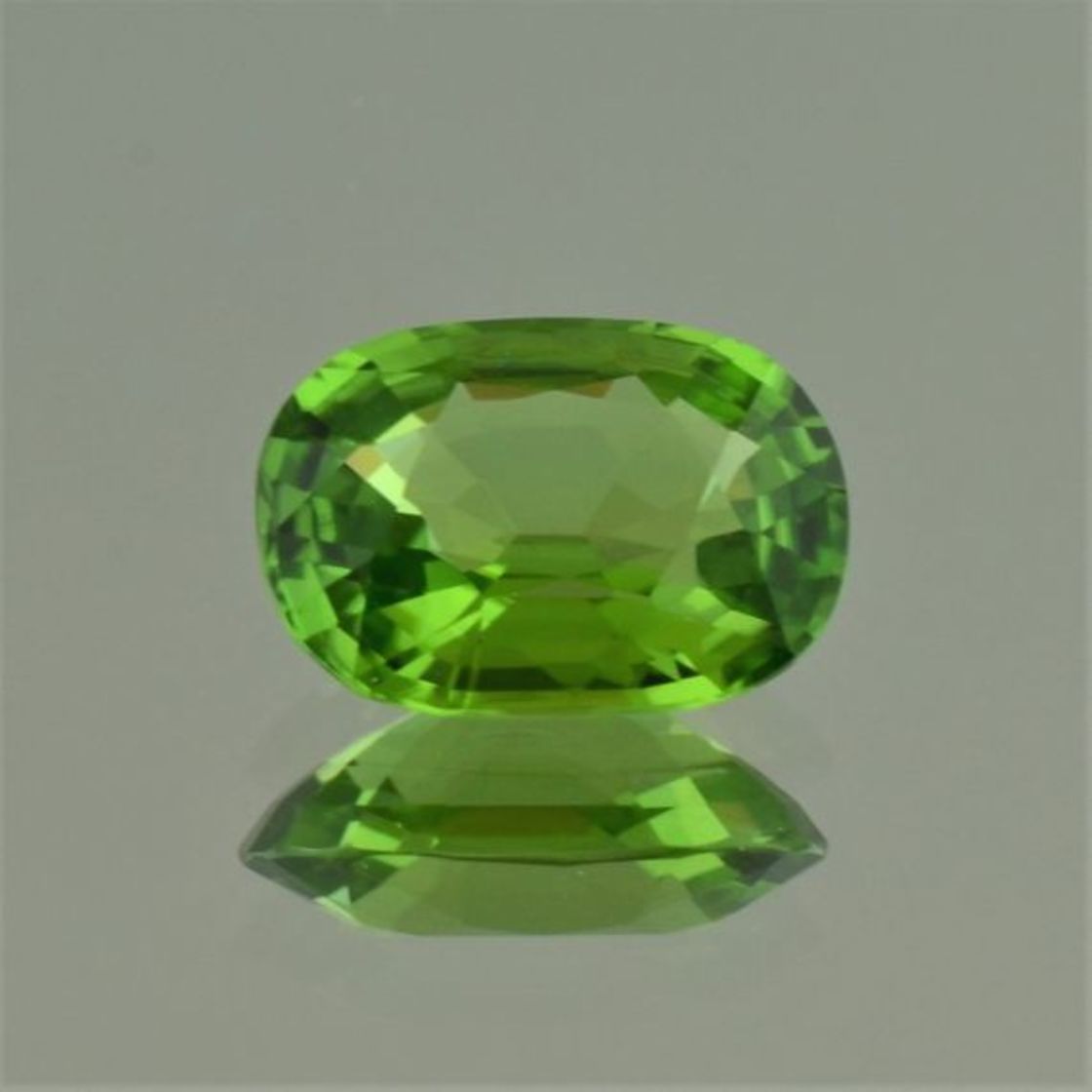 Peridot cushion green untreated 5.85 ct