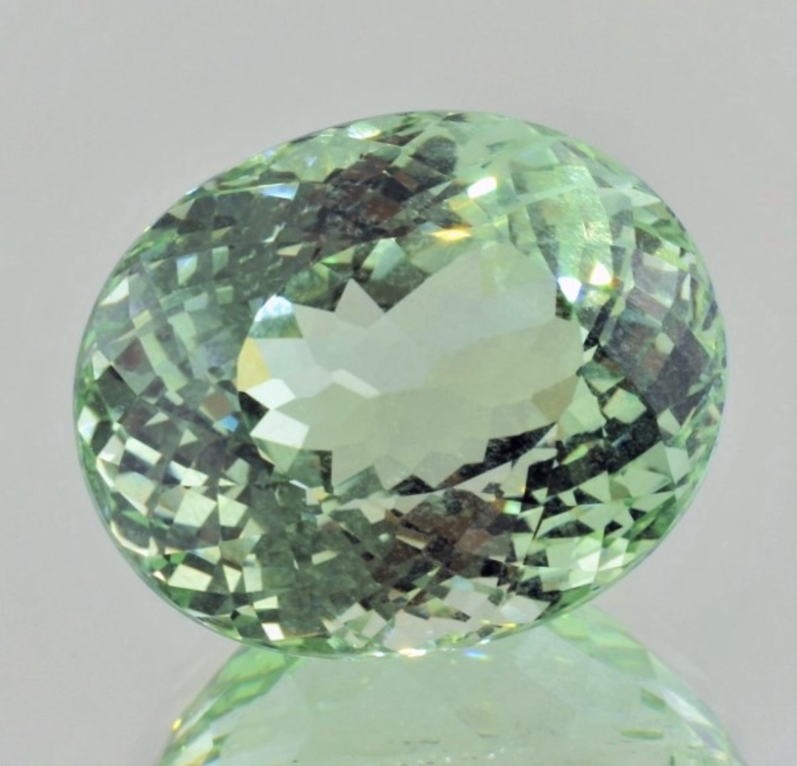 Beryl oval light green untreated 64.22 ct.