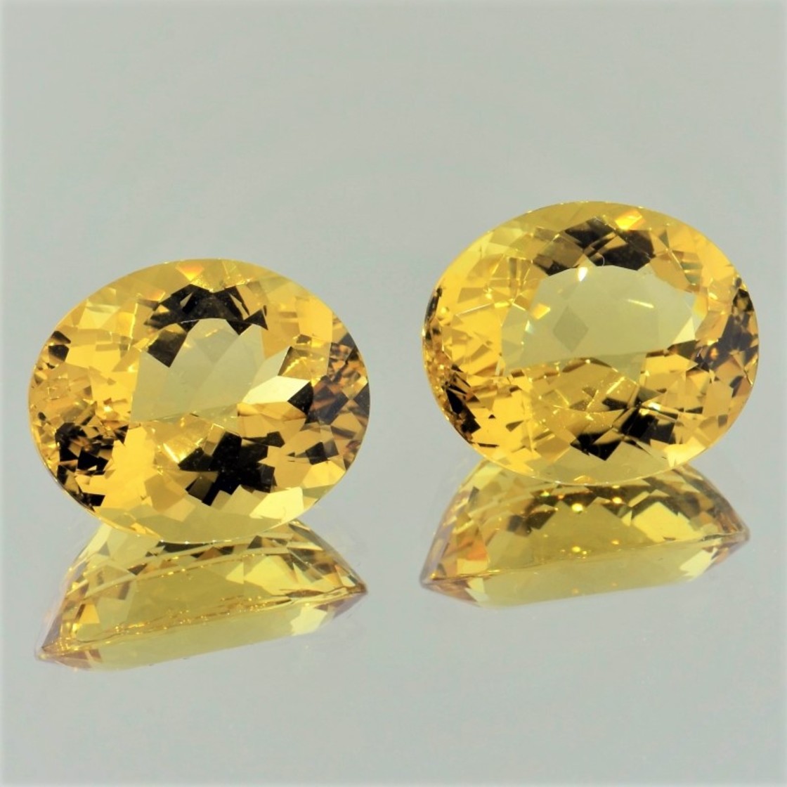 Golden Beryl Pair oval golden yellow 21.26 ct