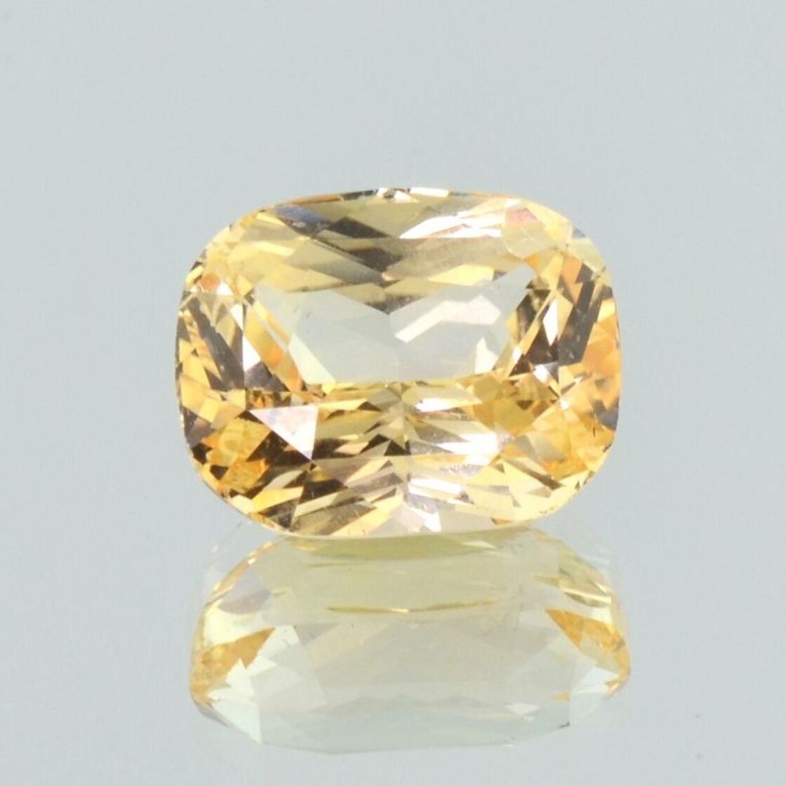 Sapphire cushion light orange yellow untreated 7.59 ct.