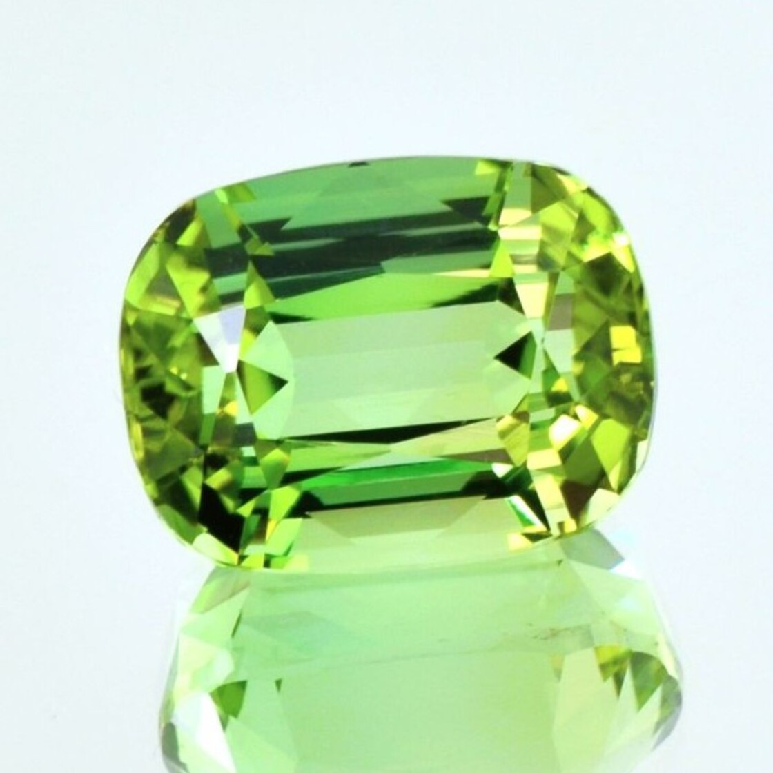 Tourmaline cushion yellowish light green 21.82 ct.