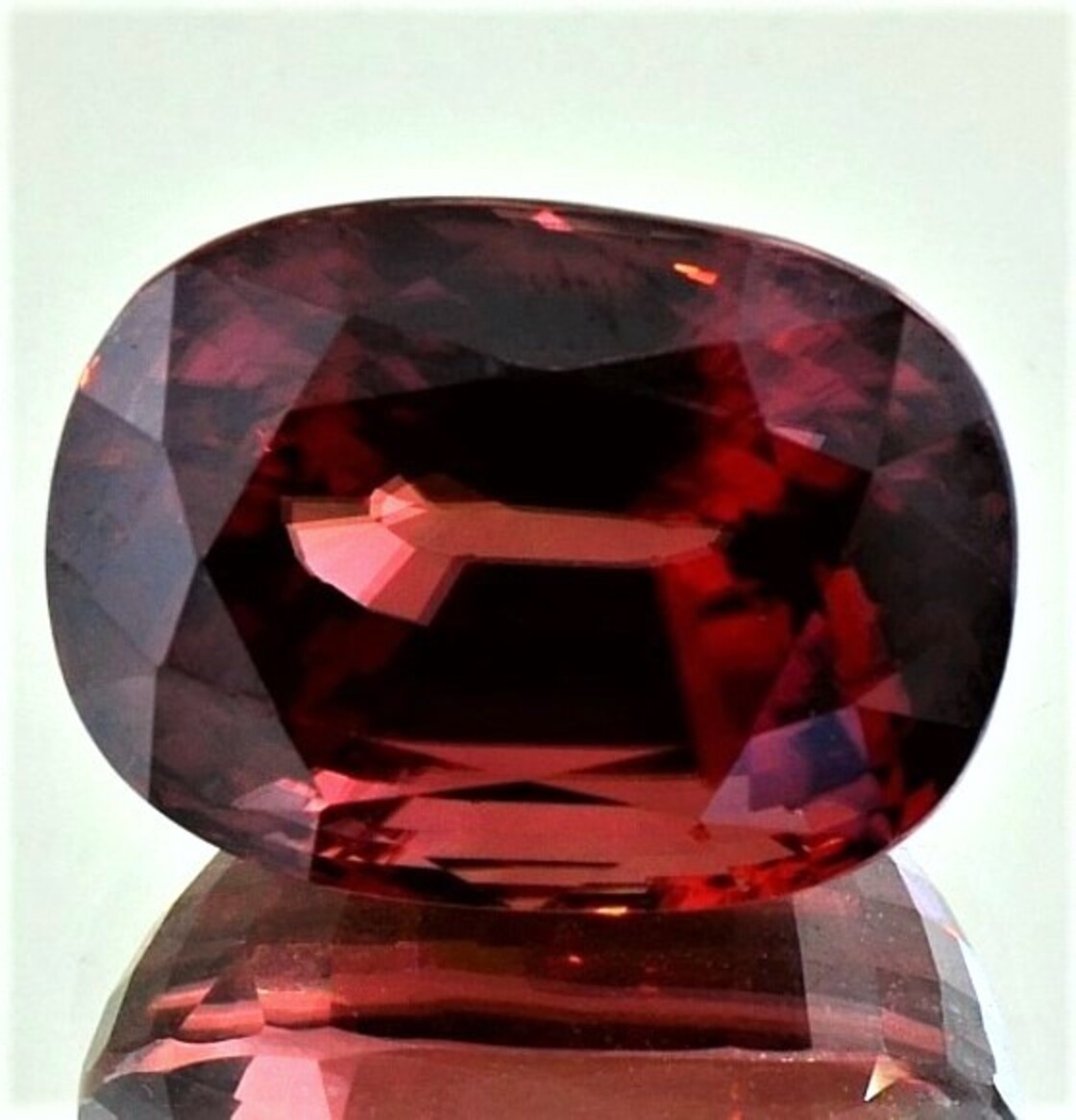 Zircon cushion reddish untreated 40.240 ct