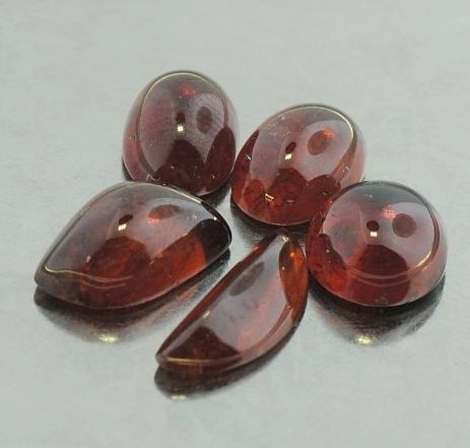 Spessartin Granat Lot, Freiform, Oval & Rund Cabochon (12,23 ct.) aus Nigeria Spessartin Granat Lot, Freiform, Oval & Rund Cabochon (12,23 ct.) aus Nigeria