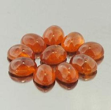 Spessartin Granat Lot, Oval Cabochon (20,76 ct.) aus Madagaskar Spessartin Granat Lot, Oval Cabochon (20,76 ct.) aus Madagaskar