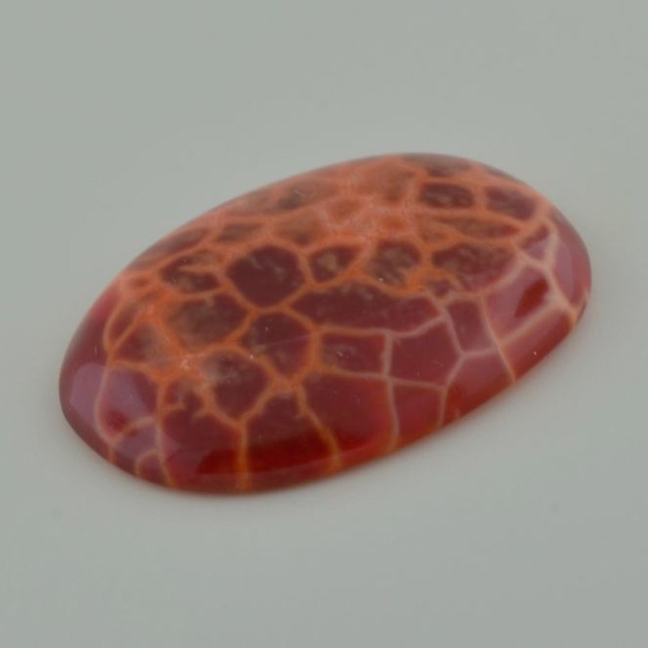 Quartz cabochon fantasy behandelt reddish orange 68.33 ct