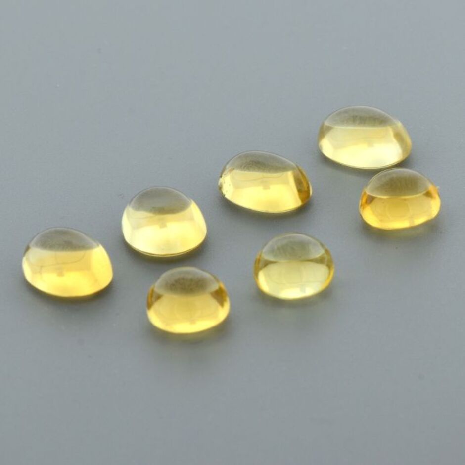 Citrine Lot cabochons oval+rund yellow 17.42 ct.