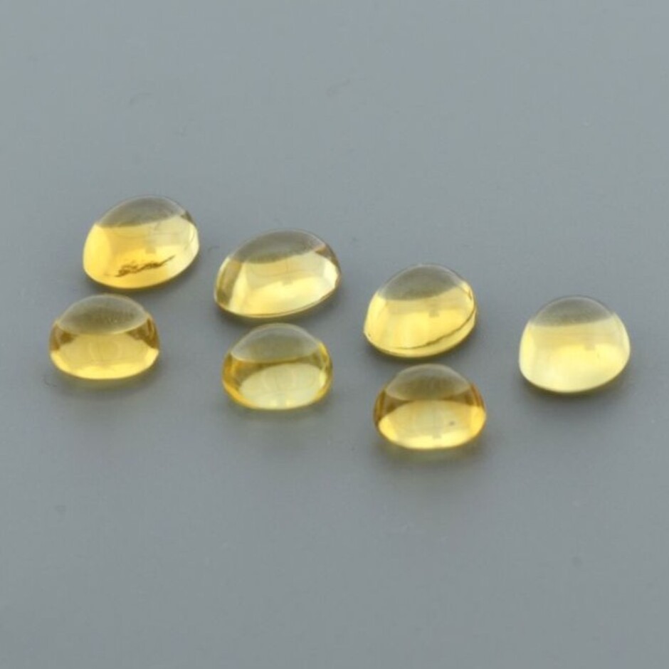 Citrine Lot cabochons oval+rund yellow 17.42 ct.